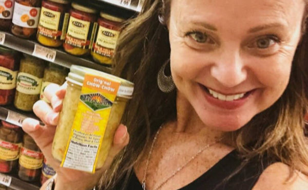 Woman holding an EverLicious jar in a store